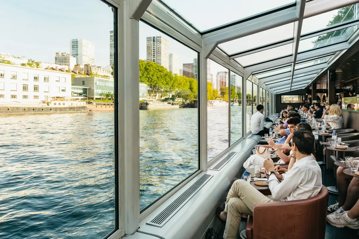 Seine dinner cruise in Paris with illuminated city views