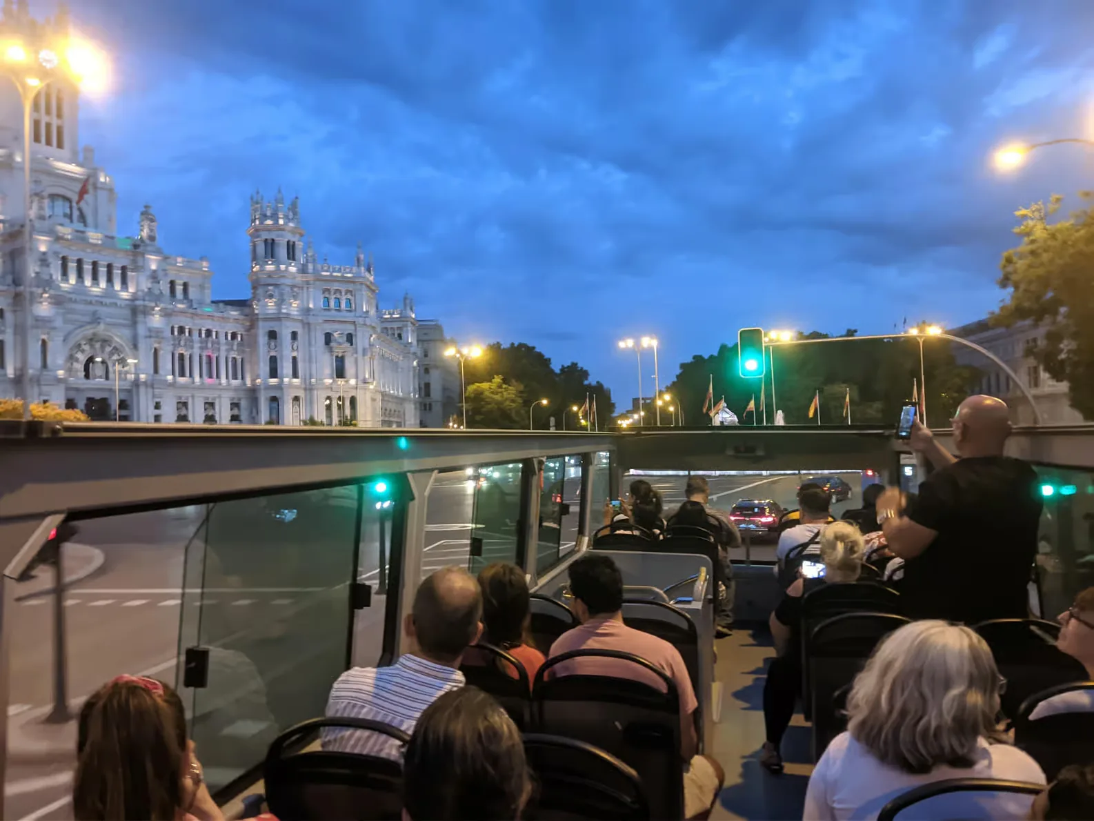 See Madrid lit up from an open-top bus