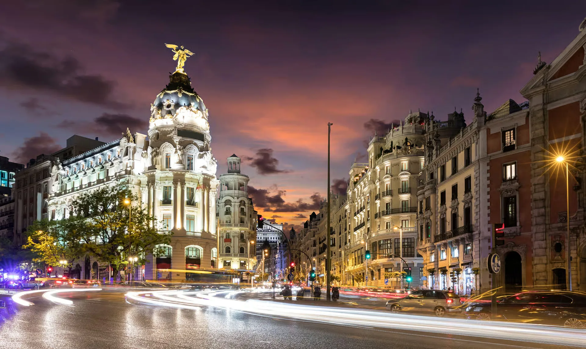 See Madrid lit up from an open-top bus